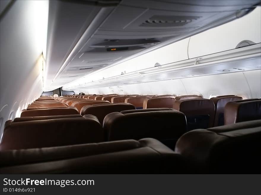 View of the main cabin on an airliner while in flight. View of the main cabin on an airliner while in flight.