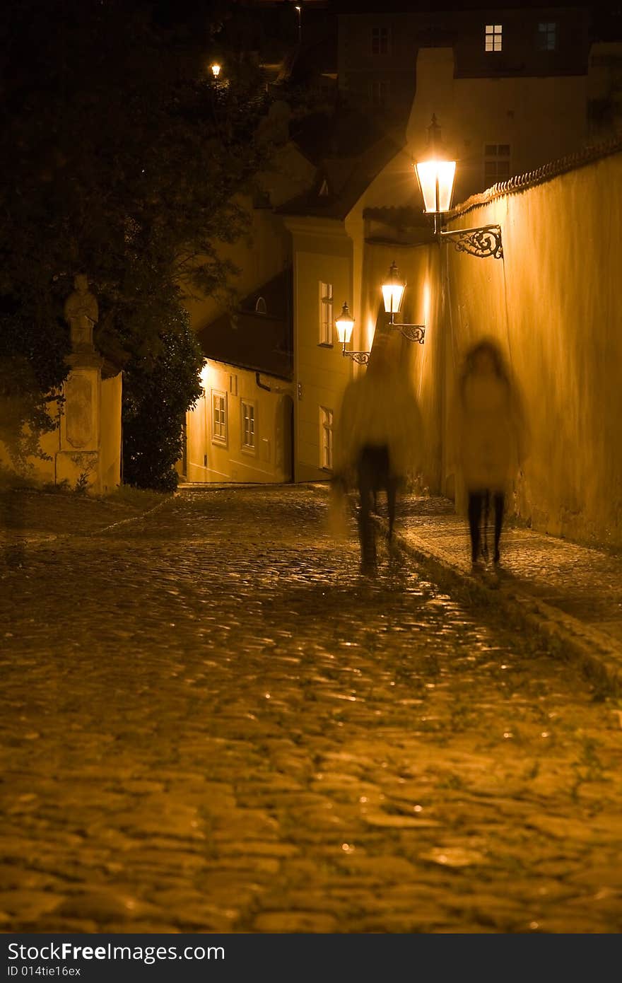 Night lane in Prague Old Town with couple. Night lane in Prague Old Town with couple.