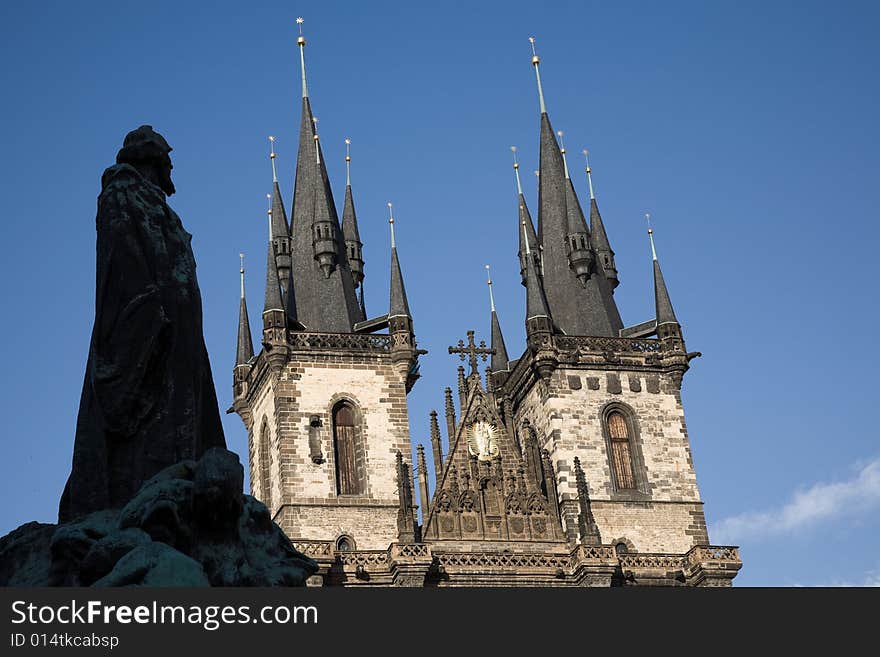 Silhouette of Jan Hus statue and St. Teyn gothic cathedral on Old Town Square in Prague. Silhouette of Jan Hus statue and St. Teyn gothic cathedral on Old Town Square in Prague.