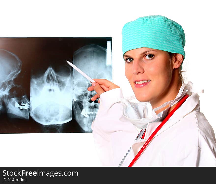 A young female medical lab worker with a x-ray in the background and a stethoscope around the neck! Isolated over white.