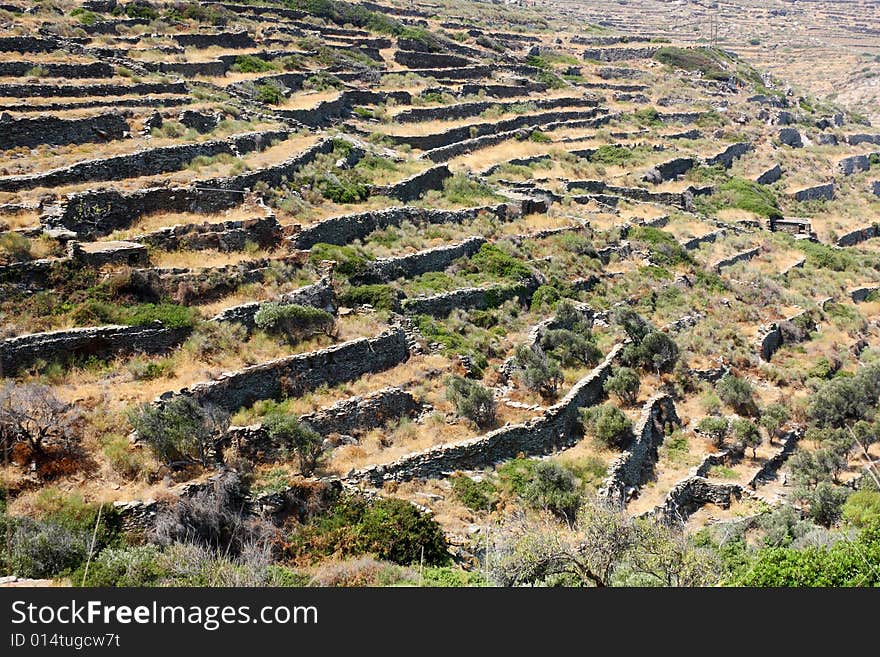 Terraces on the slopes of the arid landscape of the island of Tinos, Greece. Terraces on the slopes of the arid landscape of the island of Tinos, Greece