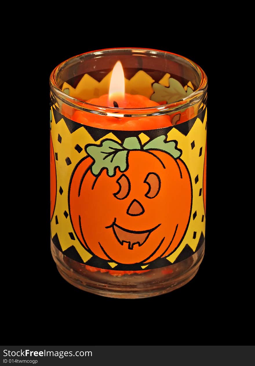 Jackolantern halloween candle isolated on a black background