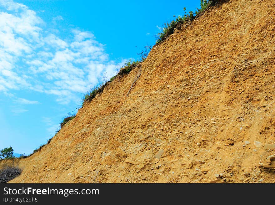 Colored yellow wall of open pit (quarry). Colored yellow wall of open pit (quarry)