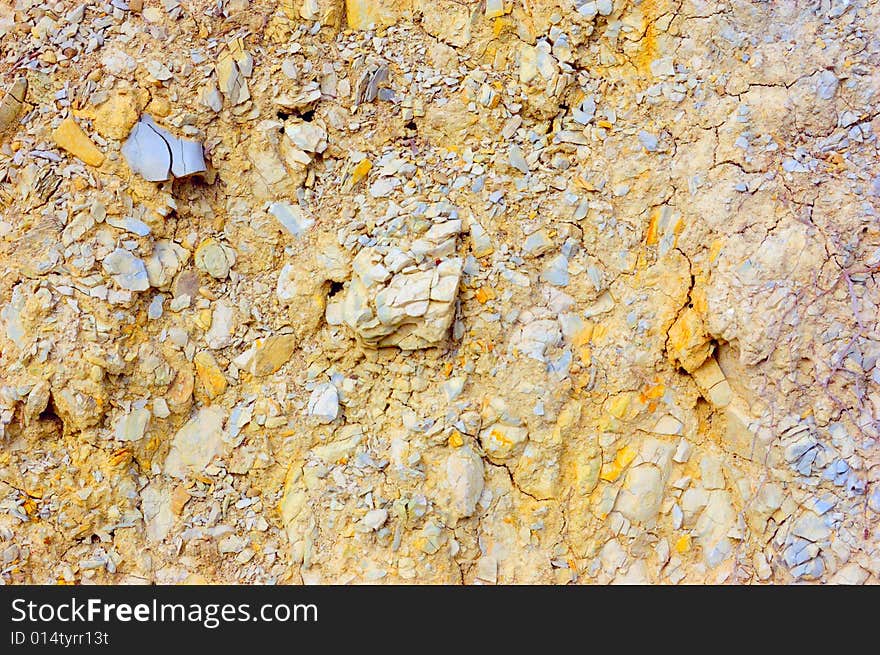 Colored rough yellow rock surface