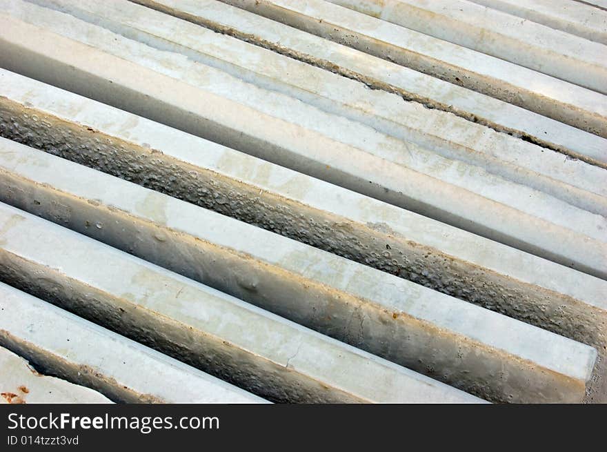 Stack of slabs (bricks) of grey color for pavement