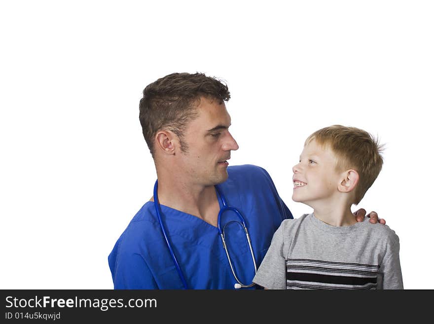 A doctor talks to a happy young child. A doctor talks to a happy young child