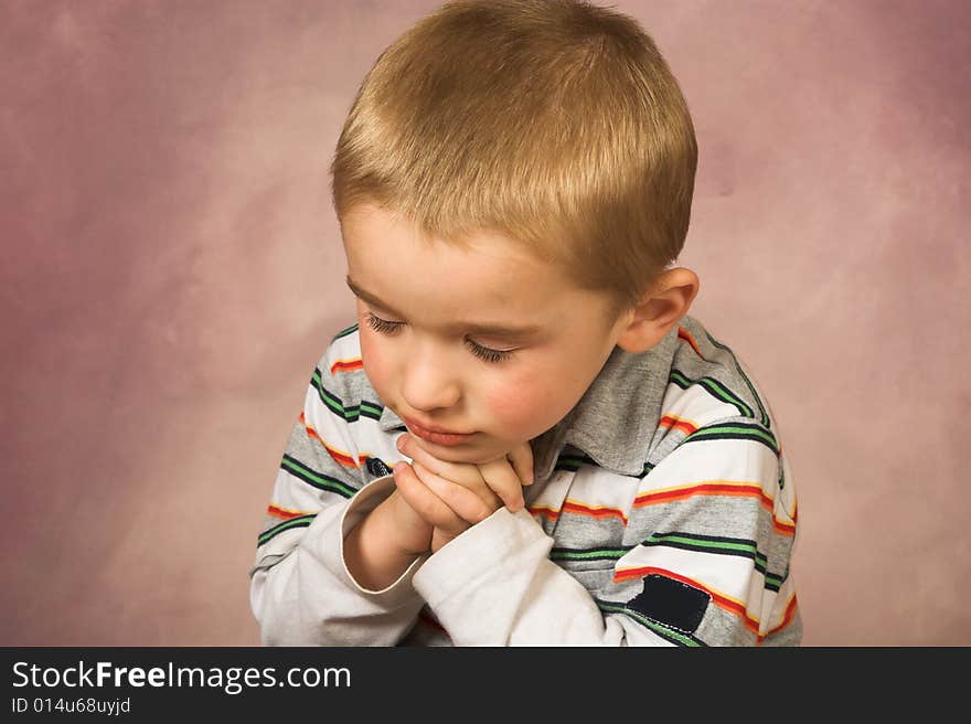 Young boy with short hair and beautiful facial expressions