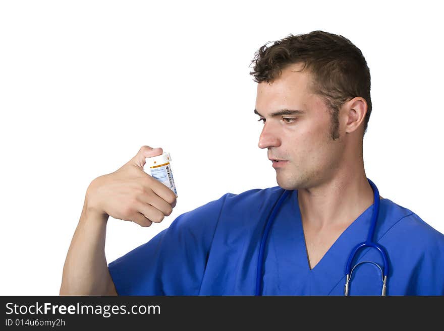 Doctor looking at pill bottle