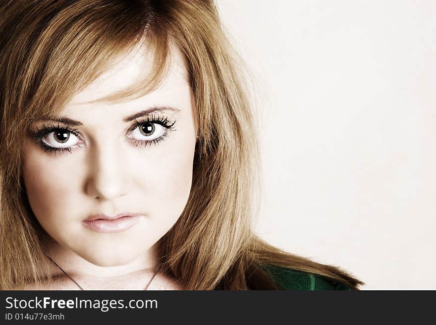 Beautiful young model with striking green eyes. Beautiful young model with striking green eyes