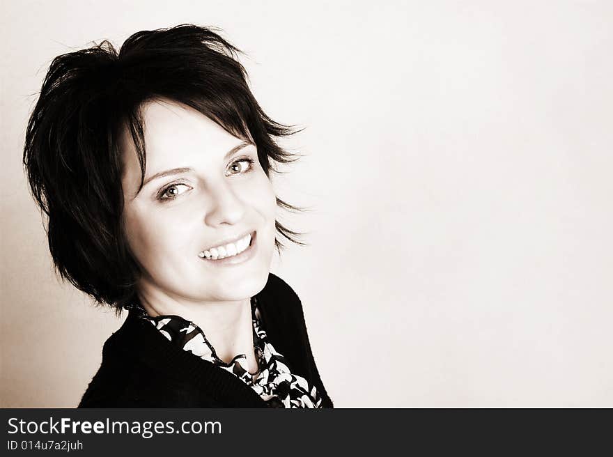 Studio shot of female brunette, head and shoulders. Studio shot of female brunette, head and shoulders