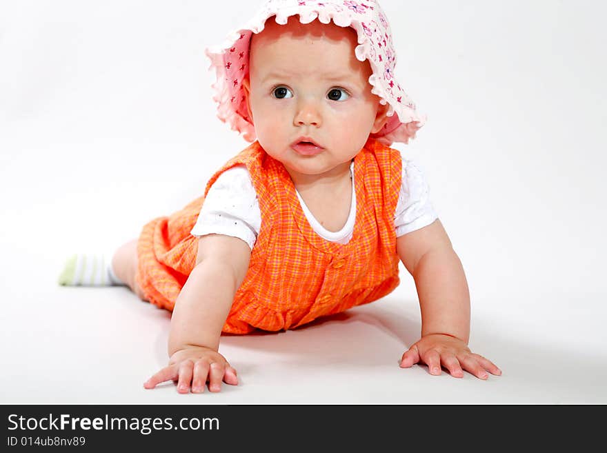 A little baby-girl crawling on the floor