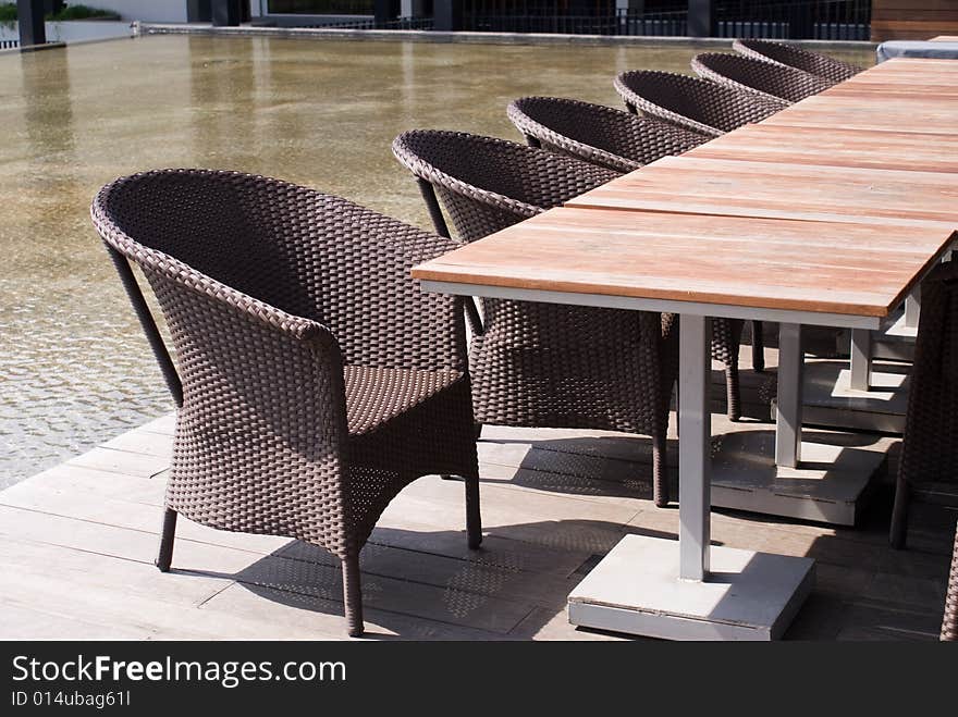 Wooden table and chairs in tropical park