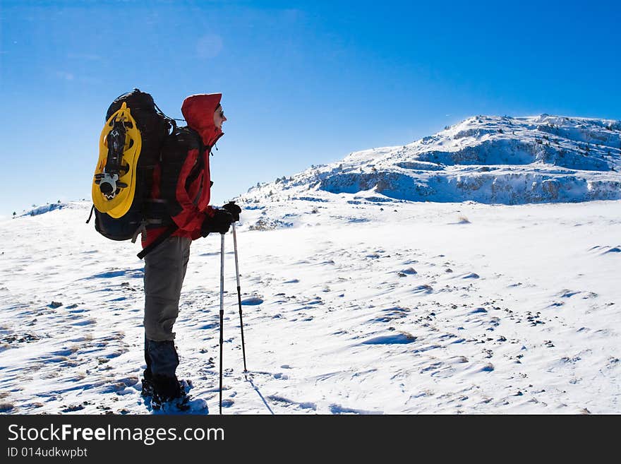 Backpacker in winter mountain, Crimea