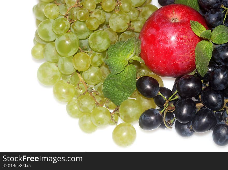 Green and red grapes and apple