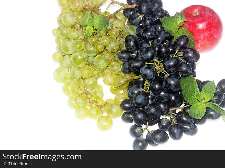 Green and red grapes and apple