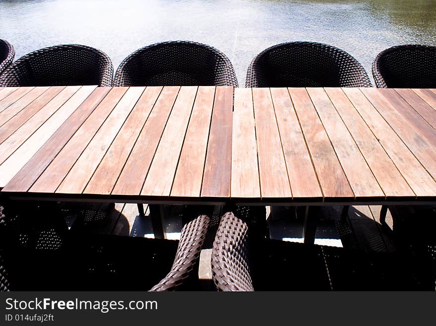 Wooden table and chairs in tropical park