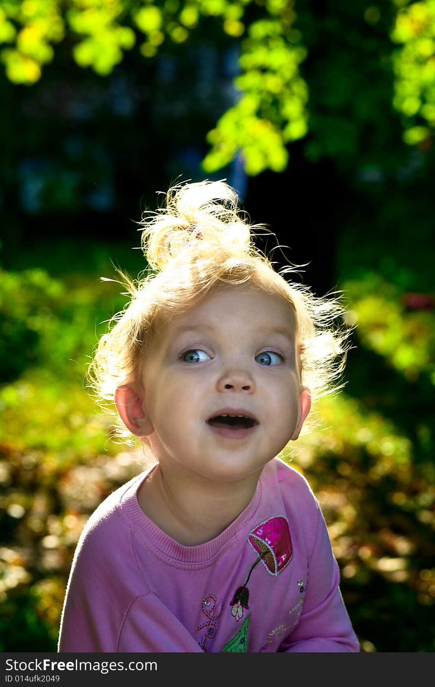 An image of little girl playing outdoor. An image of little girl playing outdoor