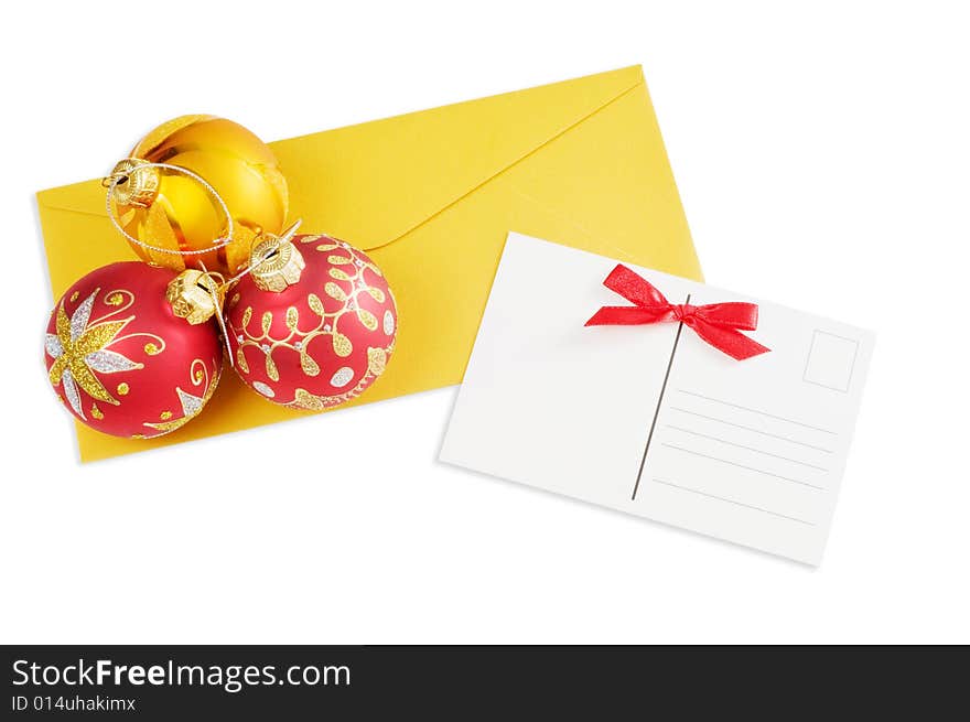 Postcard and christmas balls isolated on white background