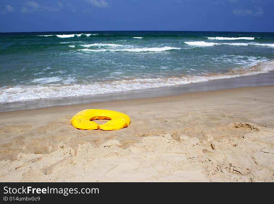 Yellow buoy and white horses on the Mediterranian sea waves