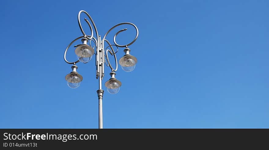 Street lamp on the blue sky