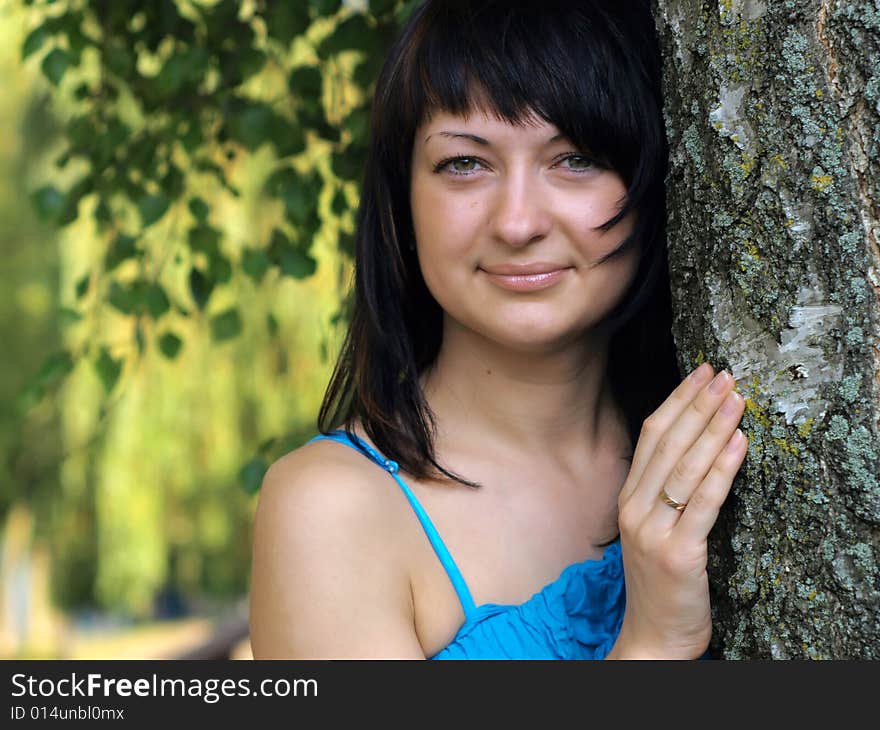 Young Woman Near Birch Tree In Summer. Young Woman Near Birch Tree In Summer