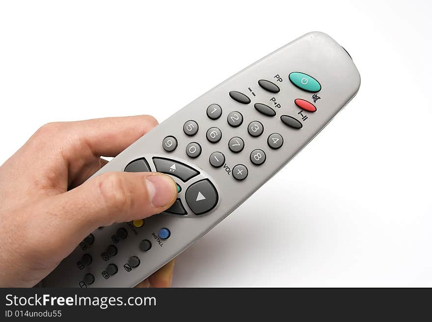 Remote in hand over white background