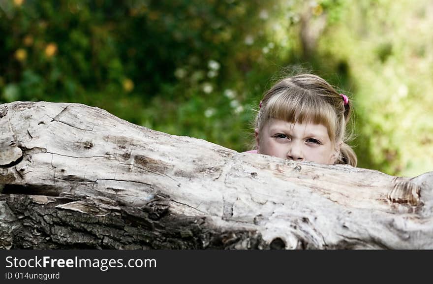 An image of little girl playing outdoor. An image of little girl playing outdoor