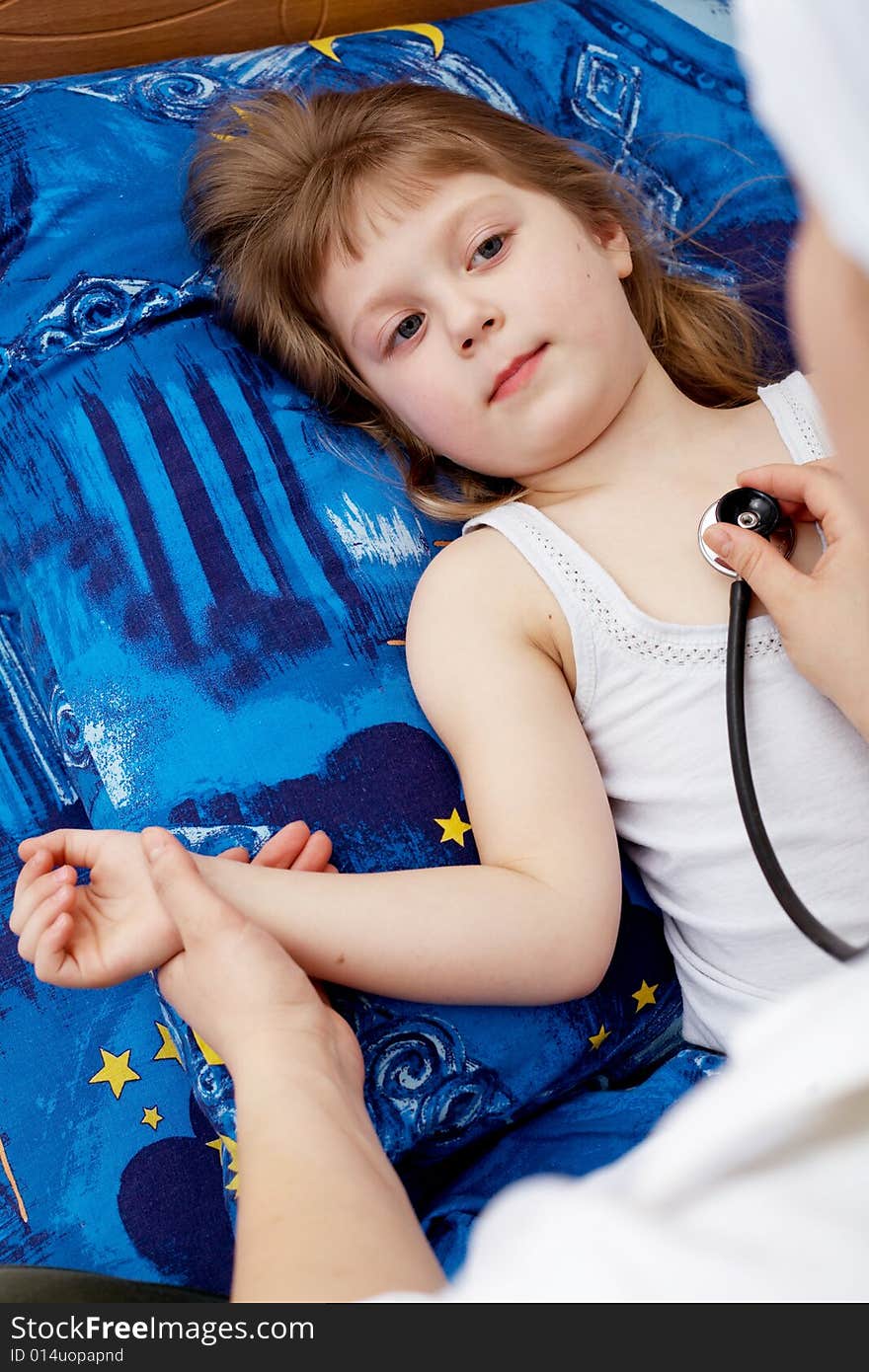 Snapshot on the theme medicine. Doctor examines a young girl. Snapshot on the theme medicine. Doctor examines a young girl