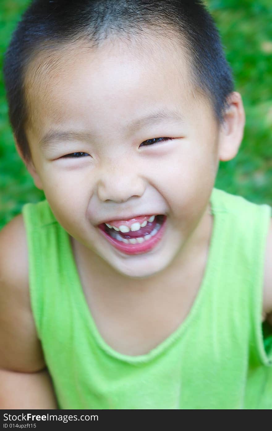 Baby laughing on the meadow