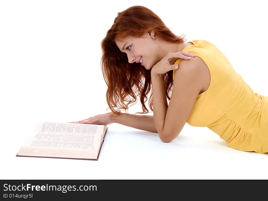 Portrait of a young student reading a book.