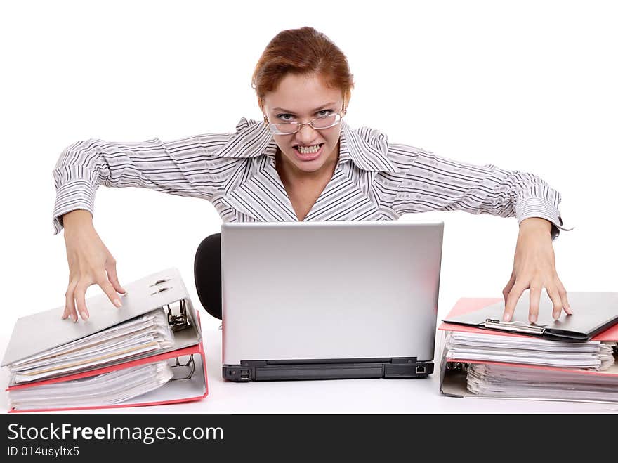 Aggravated young business lady at a table with laptop