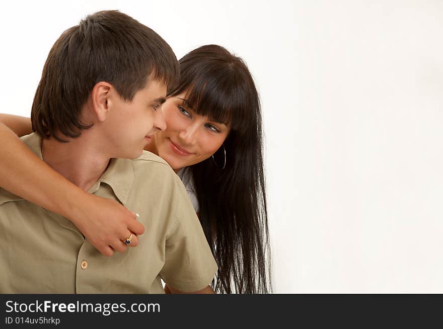 Embraces of happy pair on a white background. Embraces of happy pair on a white background