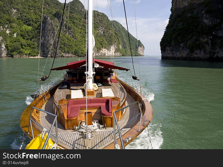 Beautiful wooden yacht sailing on the ocean. Beautiful wooden yacht sailing on the ocean