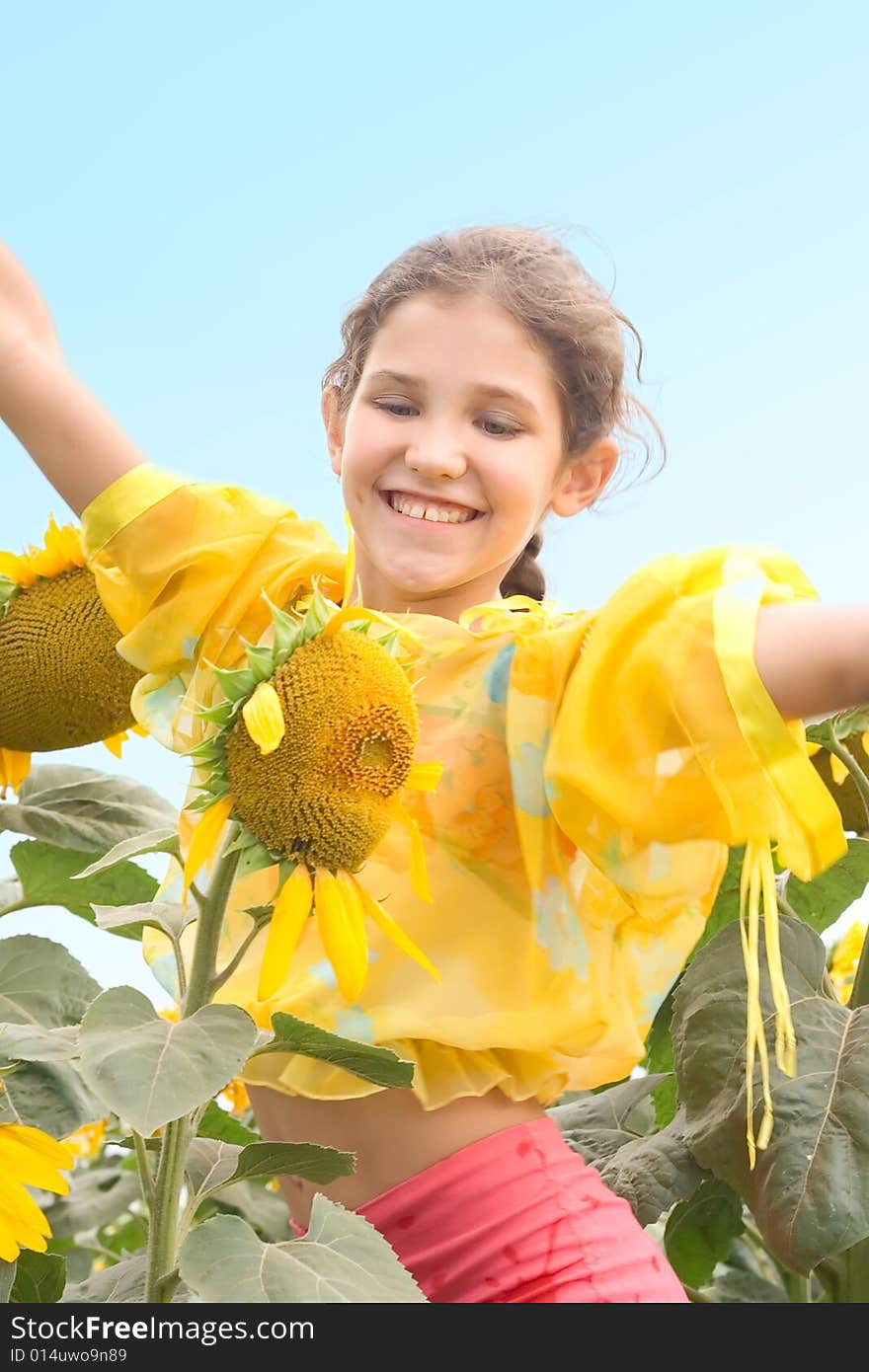 Beauty teen girl and sunflower on nature