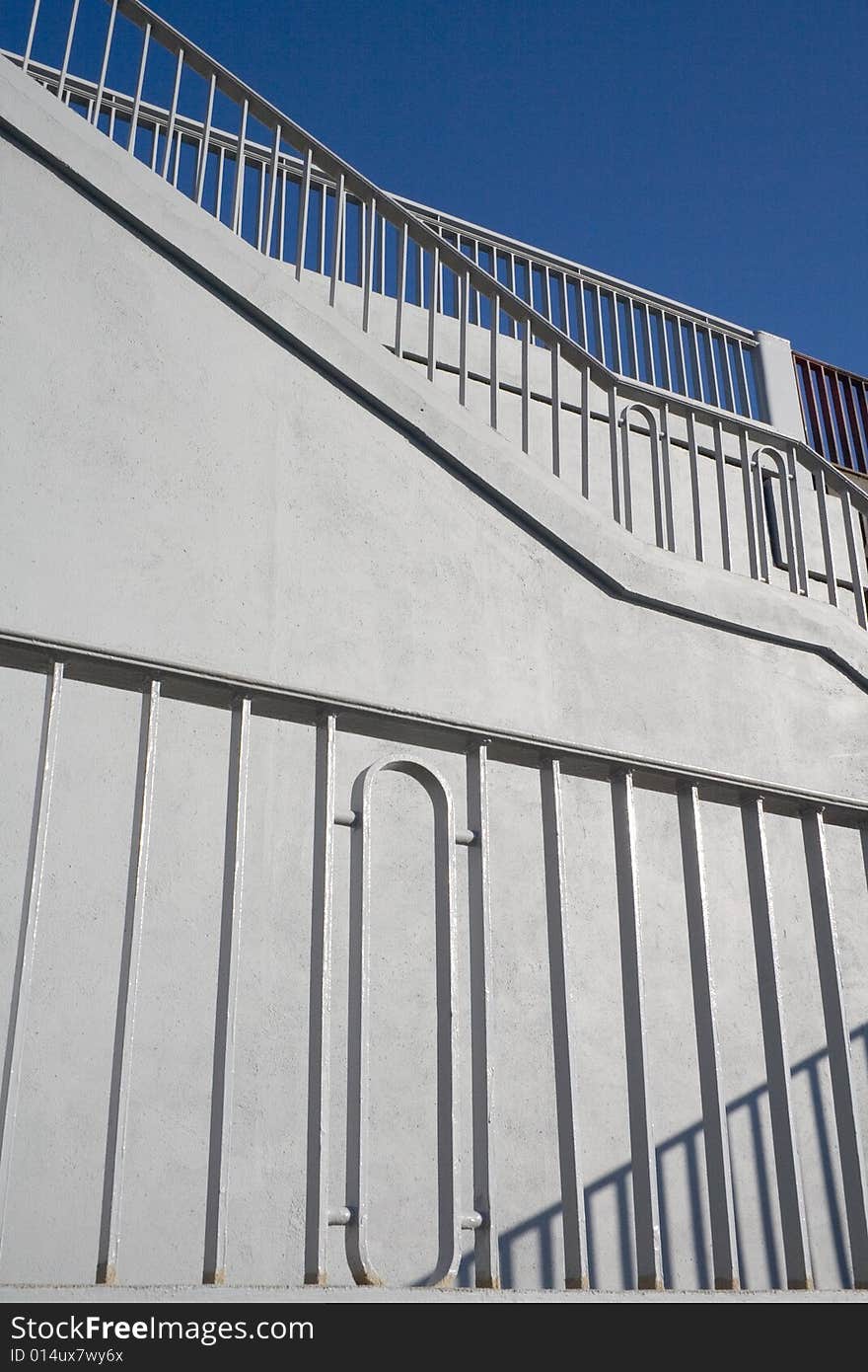 Grey ascending stairs and railing