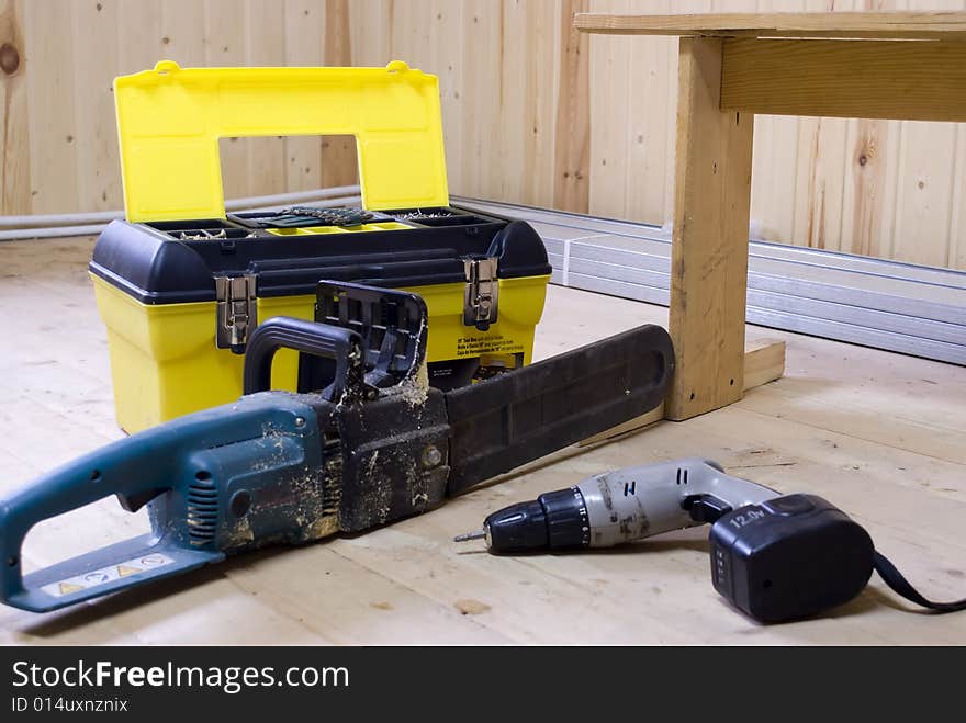 Tool box with a power saw and a turn-screw. Tool box with a power saw and a turn-screw