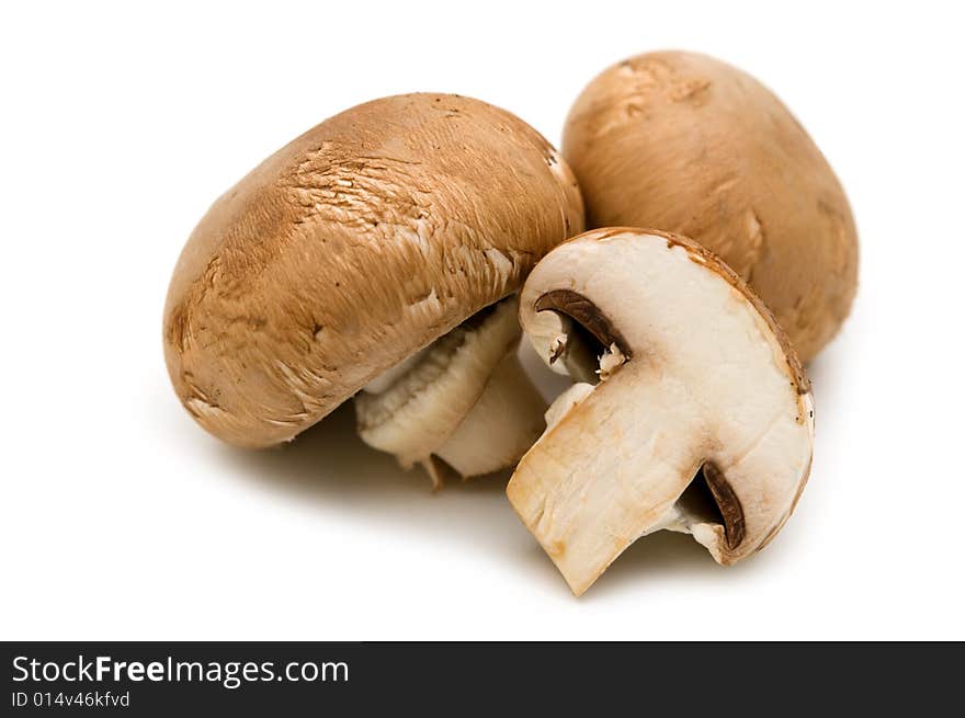 Slice brown champignon on white background