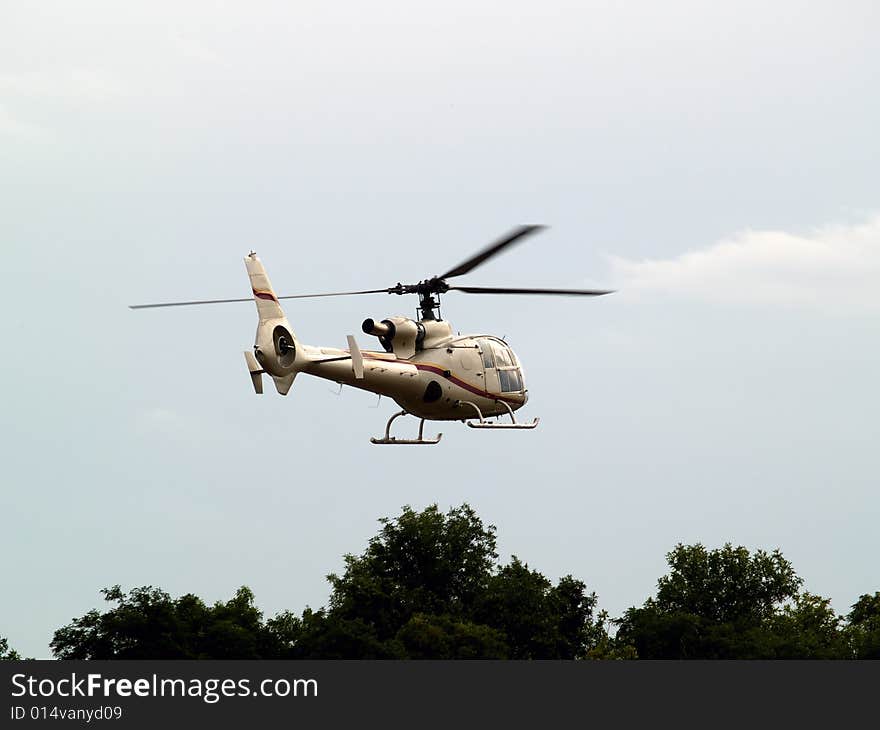 Civil helicopter hovering ready to climb and cruise