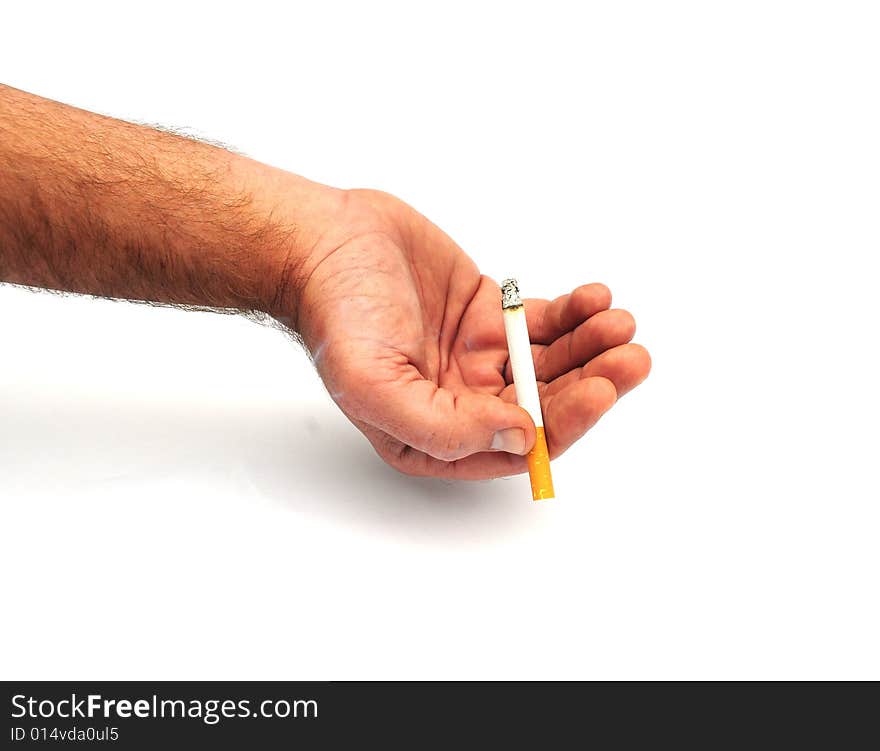 Shot of a hand holding a cigarette. Shot of a hand holding a cigarette