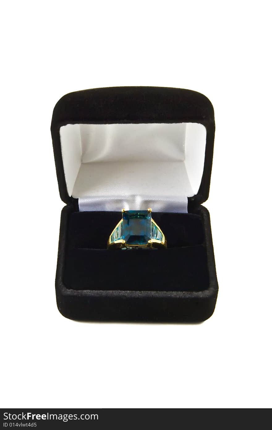 A large London blue topaz ring in a box isolated on a white background