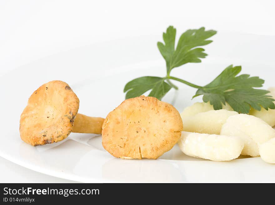 Uncooked gnocchi noodles on a plate