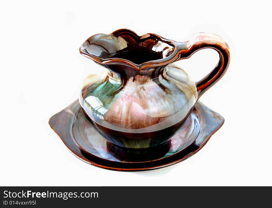 Antique style wash basin and jug isolated on a white background.