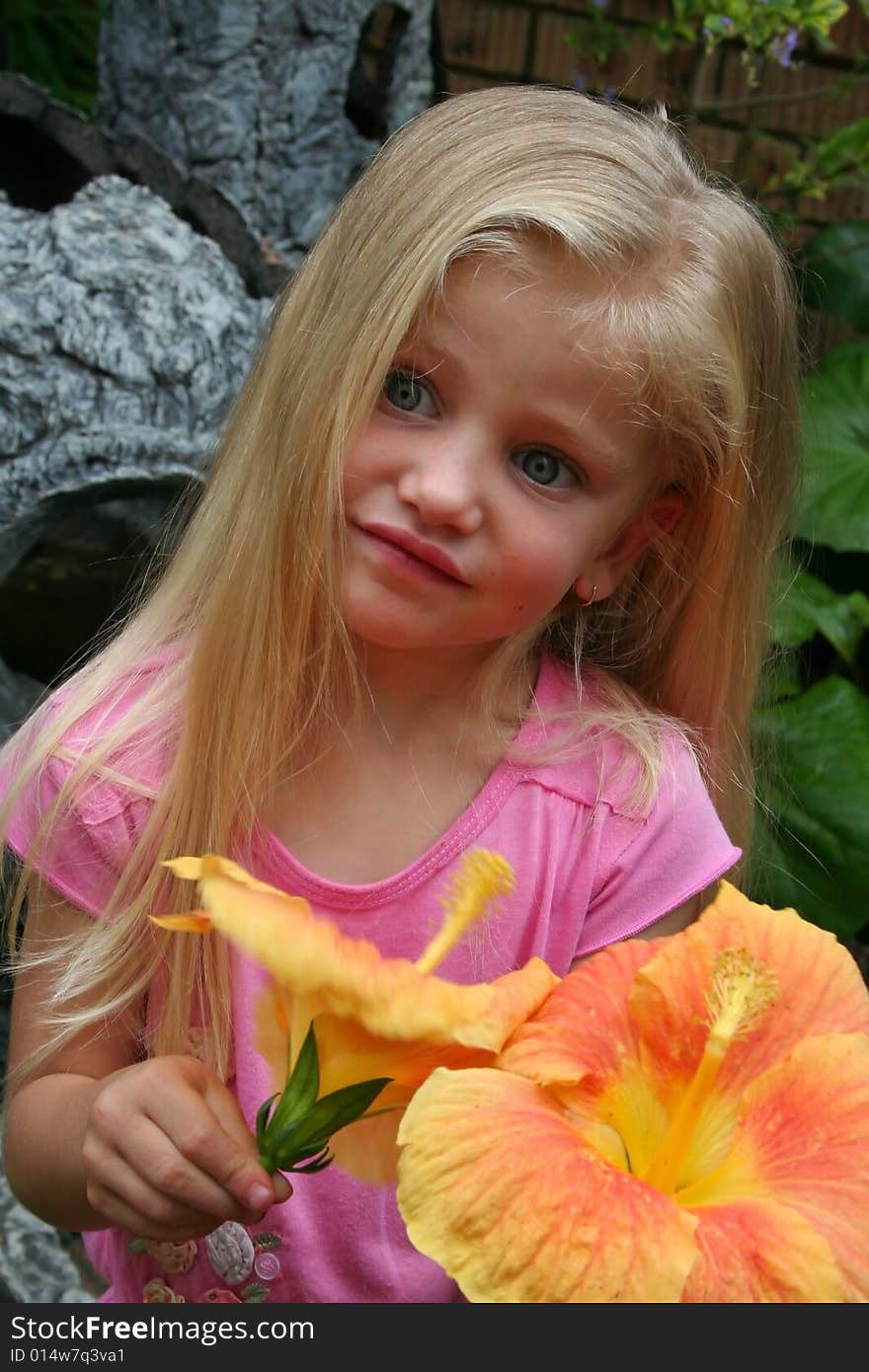 Little Girl Picking orange flowers