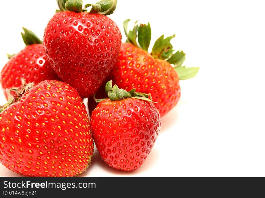 A group of strawberries isolated with a white background. A group of strawberries isolated with a white background.