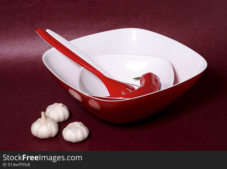 A composition with bowls, fork and garlic