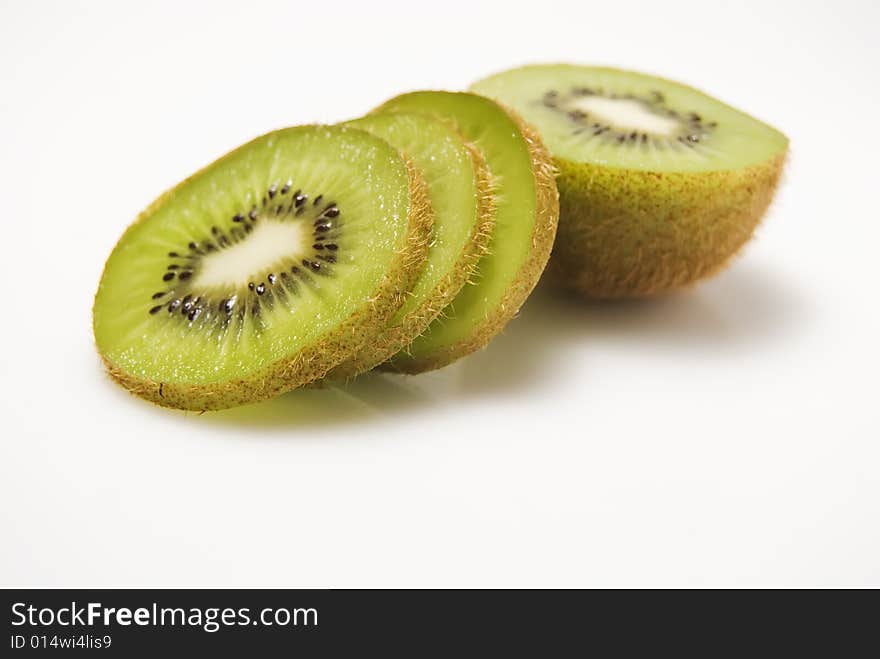 Slices of kiwi fruit on white background