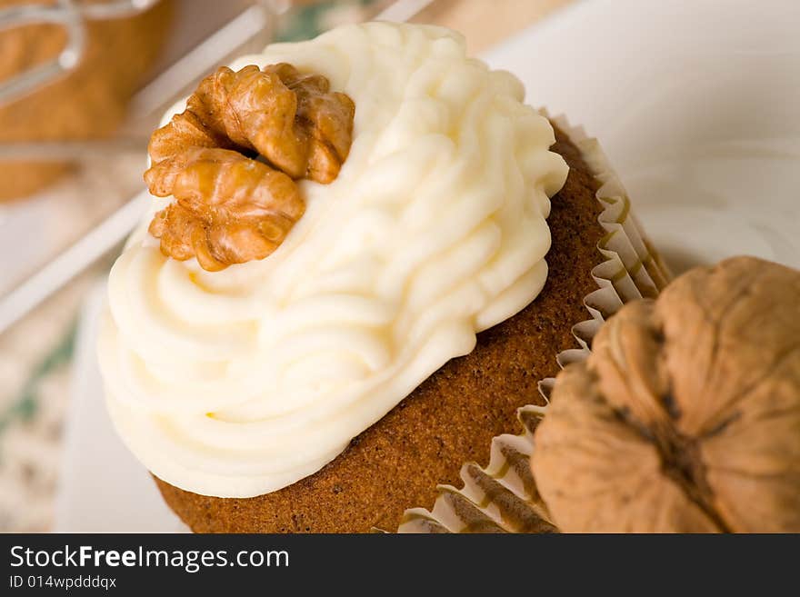 Walnuts muffins with mascarpone cheese (whipped cream).