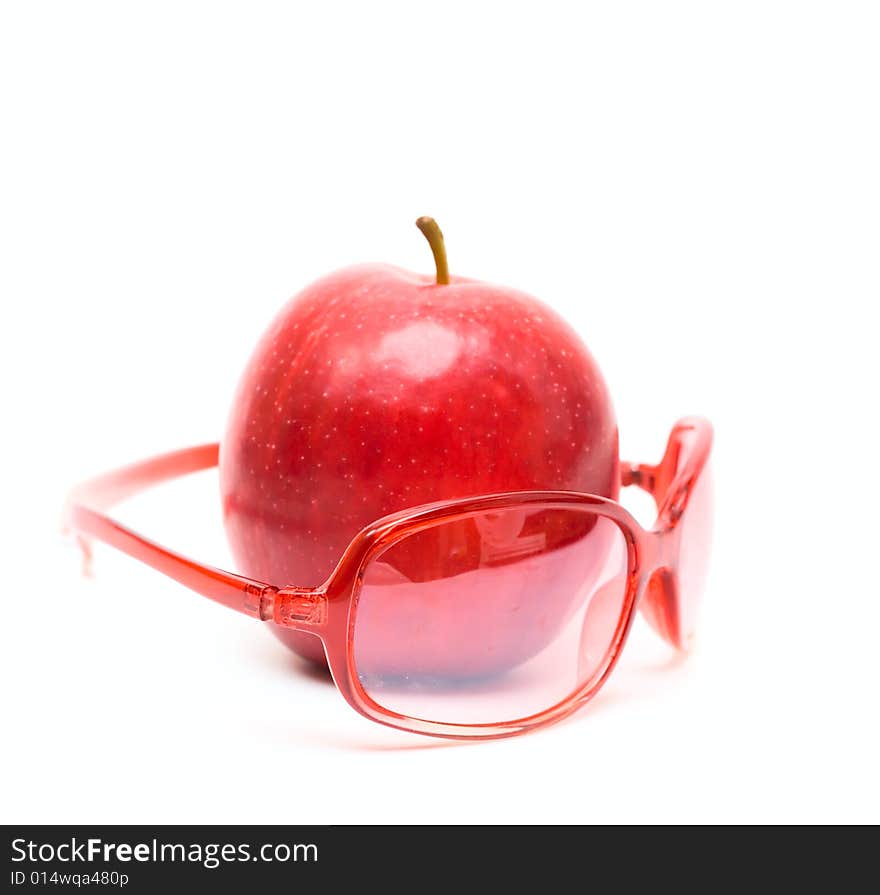 Red apple and red glasses isolated on white for your design