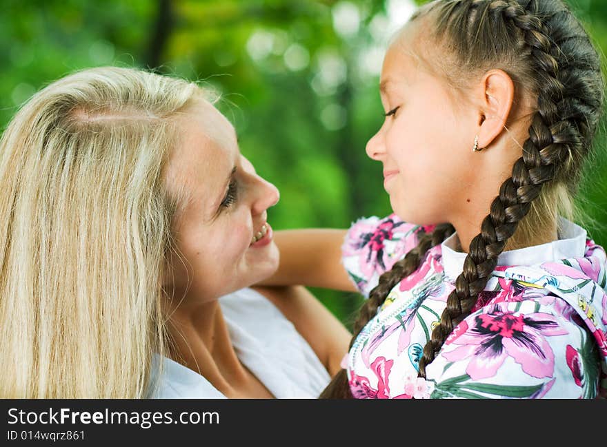 Mother and daughter looking at each other. Mother and daughter looking at each other.