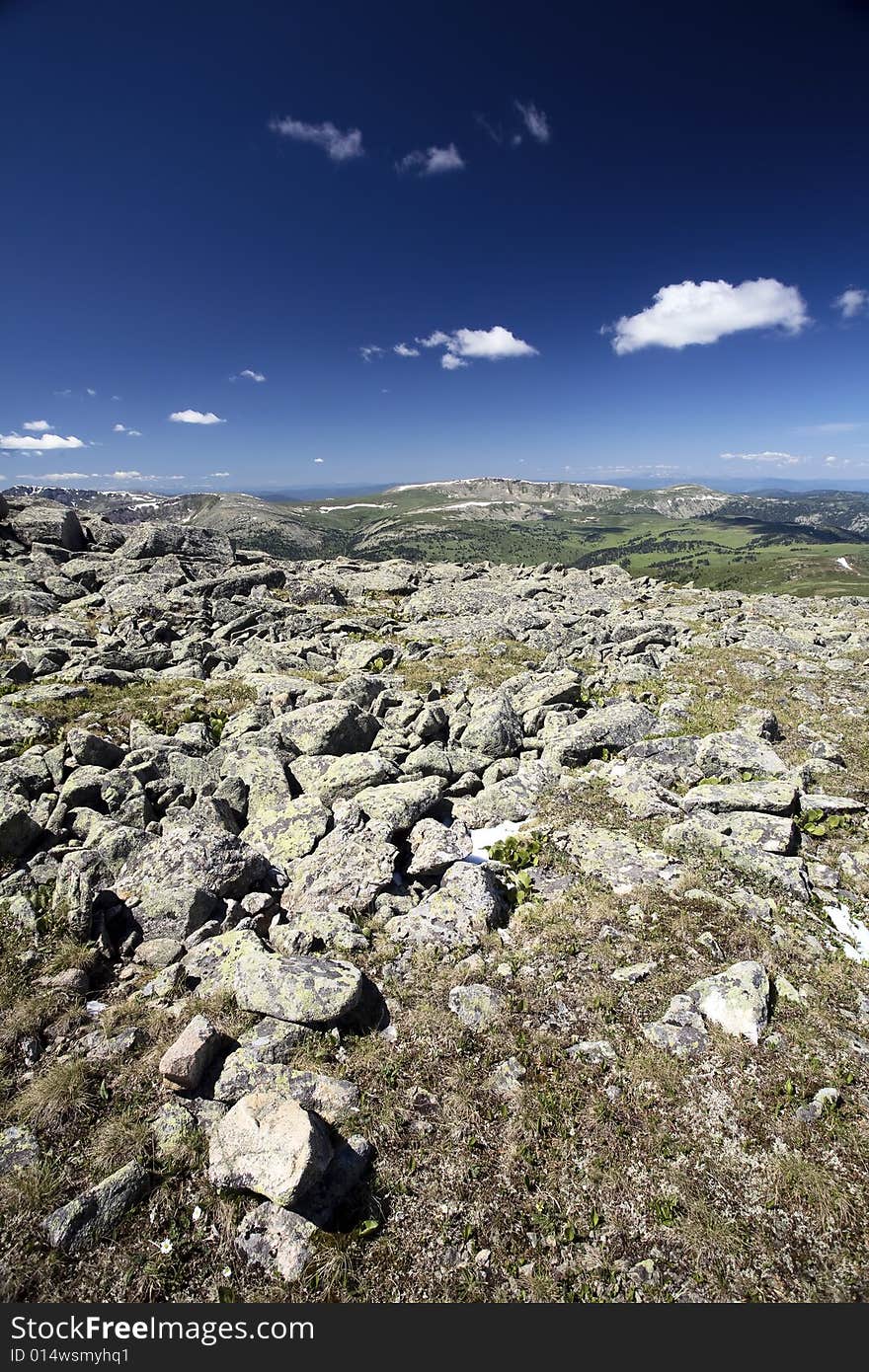 High mountain's rocks, summer, sky and clouds. High mountain's rocks, summer, sky and clouds